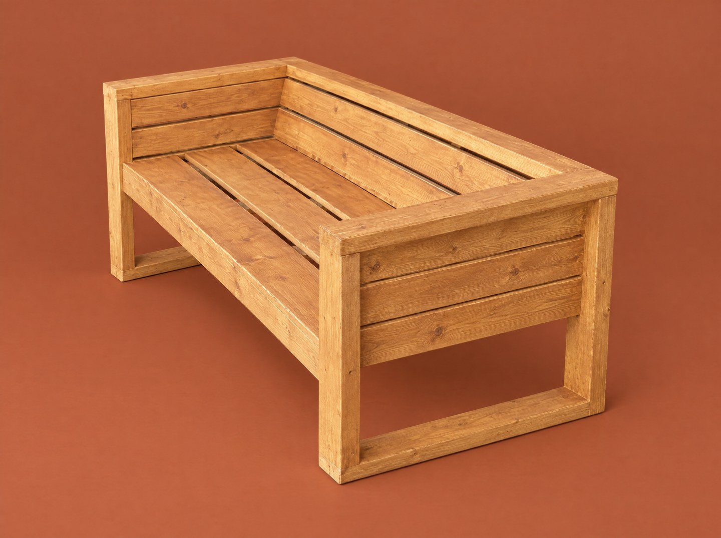 Wooden lounge bench with open side frames and a slatted seat, back and sides